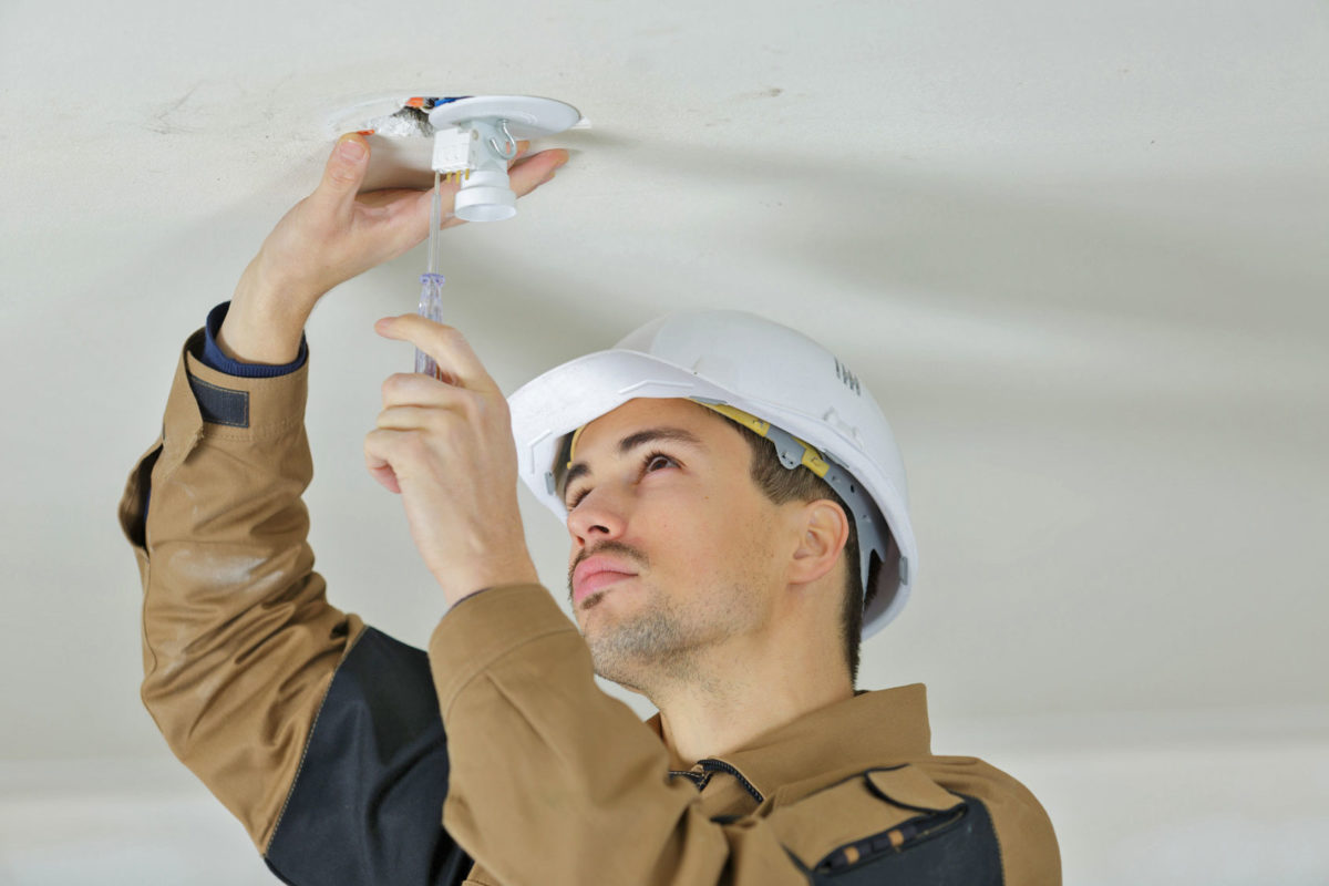 Electrician repairing electrical board Luminous llc