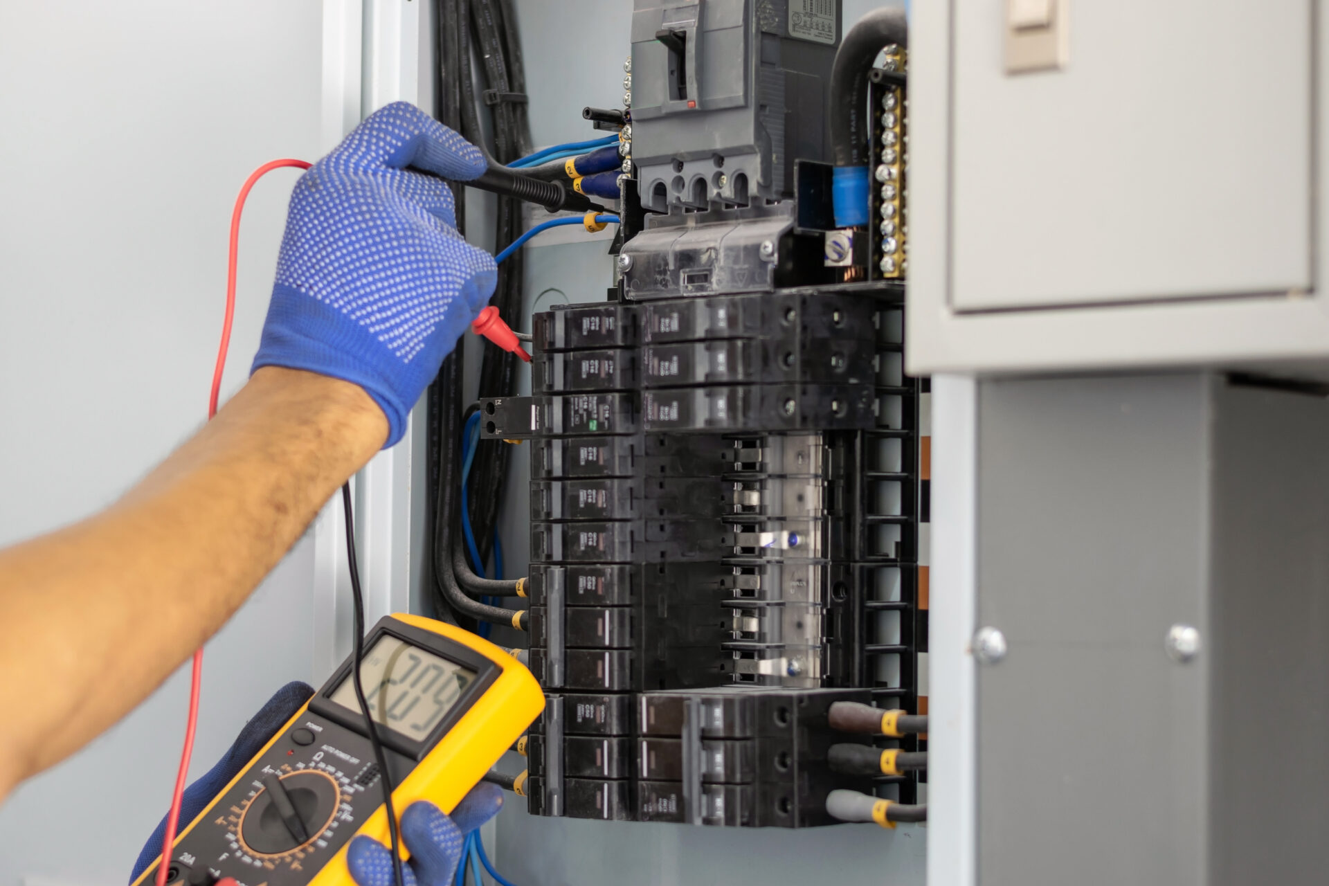 Electrician repairing electrical board in new jersey Luminous llc